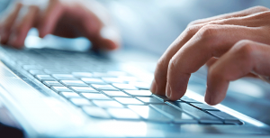 guy typing on keyboard